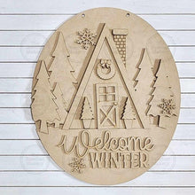 Load image into Gallery viewer, Winter Cabin Door Hanger 12.5" Oval SVG File | Laser Cut File | Reindeer SVG File | Door Hanger | Welcome Winter Door Hanger SVG
