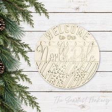 Load image into Gallery viewer, North Pole Christmas Door Hanger SVG File | Laser Cut File | Glowforge | Santa SVG | Reindeer SVG | Christmas Eve Sign svg
